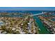 A waterfront community showing beautiful canals, multiple docks and a nearby bridge at 3110 W De Bazan Ave, St Pete Beach, FL 33706
