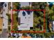 Aerial view of the home's dimensions of 83ft x 128ft outlined in red at 3110 W De Bazan Ave, St Pete Beach, FL 33706