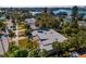 Aerial view of the home with mature landscaping, and neighborhood at 3110 W De Bazan Ave, St Pete Beach, FL 33706