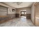 Bedroom featuring decorative wood wall, tile floor, and closet with louvered doors at 3110 W De Bazan Ave, St Pete Beach, FL 33706