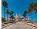 An attractive building with a beautiful driveway lined by palm trees and well-manicured hedges at 3110 W De Bazan Ave, St Pete Beach, FL 33706