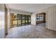 Bright living space with tile flooring, large windows, and an open doorway at 3110 W De Bazan Ave, St Pete Beach, FL 33706