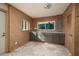 Functional mud room boasts ample cabinets, granite countertops and an abundance of natural light at 3110 W De Bazan Ave, St Pete Beach, FL 33706