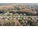 Aerial view of community featuring multiple villas with lush landscaping at 3185 Charter Club Dr # A, Tarpon Springs, FL 34688