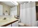Bathroom with shower/tub combo and updated vanity at 3185 Charter Club Dr # A, Tarpon Springs, FL 34688