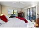 Bright bedroom with king-size bed and sliding doors at 3185 Charter Club Dr # A, Tarpon Springs, FL 34688