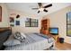 Bright bedroom with double bed and wood shelving at 3185 Charter Club Dr # A, Tarpon Springs, FL 34688
