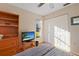 Bedroom with double bed, closet and wood shelving at 3185 Charter Club Dr # A, Tarpon Springs, FL 34688
