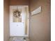 Inviting entryway with a white door and a charming wreath at 3185 Charter Club Dr # A, Tarpon Springs, FL 34688