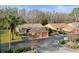 Attractive villa with a two-car garage and lush landscaping at 3185 Charter Club Dr # A, Tarpon Springs, FL 34688