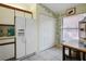 Bright kitchen featuring white appliances and wood cabinets at 3185 Charter Club Dr # A, Tarpon Springs, FL 34688