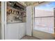 Laundry area with washer, dryer, and shelving for storage at 3185 Charter Club Dr # A, Tarpon Springs, FL 34688