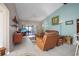Comfortable living room, leather furniture and access to lanai at 3185 Charter Club Dr # A, Tarpon Springs, FL 34688