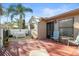 Private patio with seating area and small yard at 3185 Charter Club Dr # A, Tarpon Springs, FL 34688