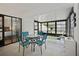 Relaxing screened porch with table and chairs at 3185 Charter Club Dr # A, Tarpon Springs, FL 34688