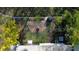 Aerial view showcasing a beautifully landscaped backyard and fire pit at 32857 Brooks Hawk Ln, Wesley Chapel, FL 33543