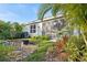 Private backyard oasis with fire pit and lush landscaping at 32857 Brooks Hawk Ln, Wesley Chapel, FL 33543