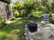 Landscaped backyard with fire pit at 32857 Brooks Hawk Ln, Wesley Chapel, FL 33543