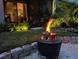Relaxing backyard fire pit area at night at 32857 Brooks Hawk Ln, Wesley Chapel, FL 33543