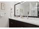 Elegant bathroom with dual vanities and large mirror at 32857 Brooks Hawk Ln, Wesley Chapel, FL 33543
