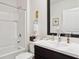 Clean bathroom with a tub, shower, and modern vanity at 32857 Brooks Hawk Ln, Wesley Chapel, FL 33543