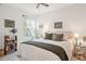 Cozy bedroom with a queen-size bed and plenty of natural light at 32857 Brooks Hawk Ln, Wesley Chapel, FL 33543