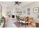 Charming dining area with unique furniture and a view of the living room at 32857 Brooks Hawk Ln, Wesley Chapel, FL 33543