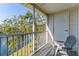 Private screened balcony overlooking a lake, offering tranquility and outdoor space at 3300 Haviland Ct # 303, Palm Harbor, FL 34684