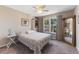 Cozy bedroom with ceiling fan, large windows, and ample closet space at 3300 Haviland Ct # 303, Palm Harbor, FL 34684