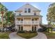 Two-story building exterior with stairs, balconies, and landscaping, offering curb appeal at 3300 Haviland Ct # 303, Palm Harbor, FL 34684