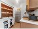 Bright and airy kitchen featuring stainless steel appliances and ample storage at 3300 Haviland Ct # 303, Palm Harbor, FL 34684