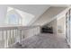 Open loft with abundant natural light and a view overlooking the living area at 3300 Haviland Ct # 303, Palm Harbor, FL 34684