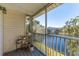 Relaxing screened balcony overlooking a lake, perfect for enjoying Florida's outdoors at 3300 Haviland Ct # 303, Palm Harbor, FL 34684
