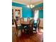 Elegant dining room featuring a round table and teal walls at 3502 W Palmira Ave, Tampa, FL 33629