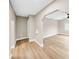 Bright hallway with light walls and wood-look flooring, leading to other rooms at 3504 N 9Th St, Tampa, FL 33605