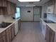 Eat-in kitchen with wood cabinets and flooring at 3736 Florida Ranch Blvd, Zephyrhills, FL 33541