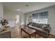 Living room with hardwood floors and gray couch at 3929 13Th N Ave, St Petersburg, FL 33713