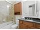 Bathroom with granite countertop, tub and shower at 4023 W Horatio St, Tampa, FL 33609