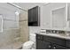 Bathroom features granite vanity and walk-in shower at 4023 W Horatio St, Tampa, FL 33609