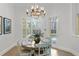 Bright dining area with table and chairs, near pool access at 4023 W Horatio St, Tampa, FL 33609