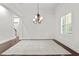 Formal dining room with hardwood floors, chandelier, and white walls at 4023 W Horatio St, Tampa, FL 33609