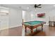 Game room with billiard table and large TV at 4023 W Horatio St, Tampa, FL 33609