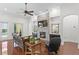 Spacious Gathering room with a stone fireplace, built-in cabinets, and hardwood floors at 4023 W Horatio St, Tampa, FL 33609