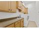 Laundry room with ample cabinets and countertop space at 4023 W Horatio St, Tampa, FL 33609