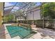 Resort-style pool and spa with screened enclosure and expansive patio at 4023 W Horatio St, Tampa, FL 33609