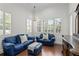 Relaxing sitting area with blue leather sofas and ottoman at 4023 W Horatio St, Tampa, FL 33609