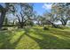 Spacious backyard with mature oak trees and grassy areas at 405 Chastain Rd, Seffner, FL 33584