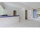 Small bar area with blue tile and access to backyard at 405 Chastain Rd, Seffner, FL 33584