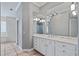 Elegant bathroom with double vanity and glass block shower at 405 Chastain Rd, Seffner, FL 33584