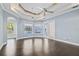 Spacious bedroom with hardwood floors and large windows at 405 Chastain Rd, Seffner, FL 33584